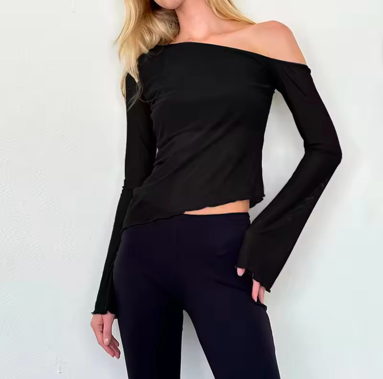 Black assymetrical top with long sleeves